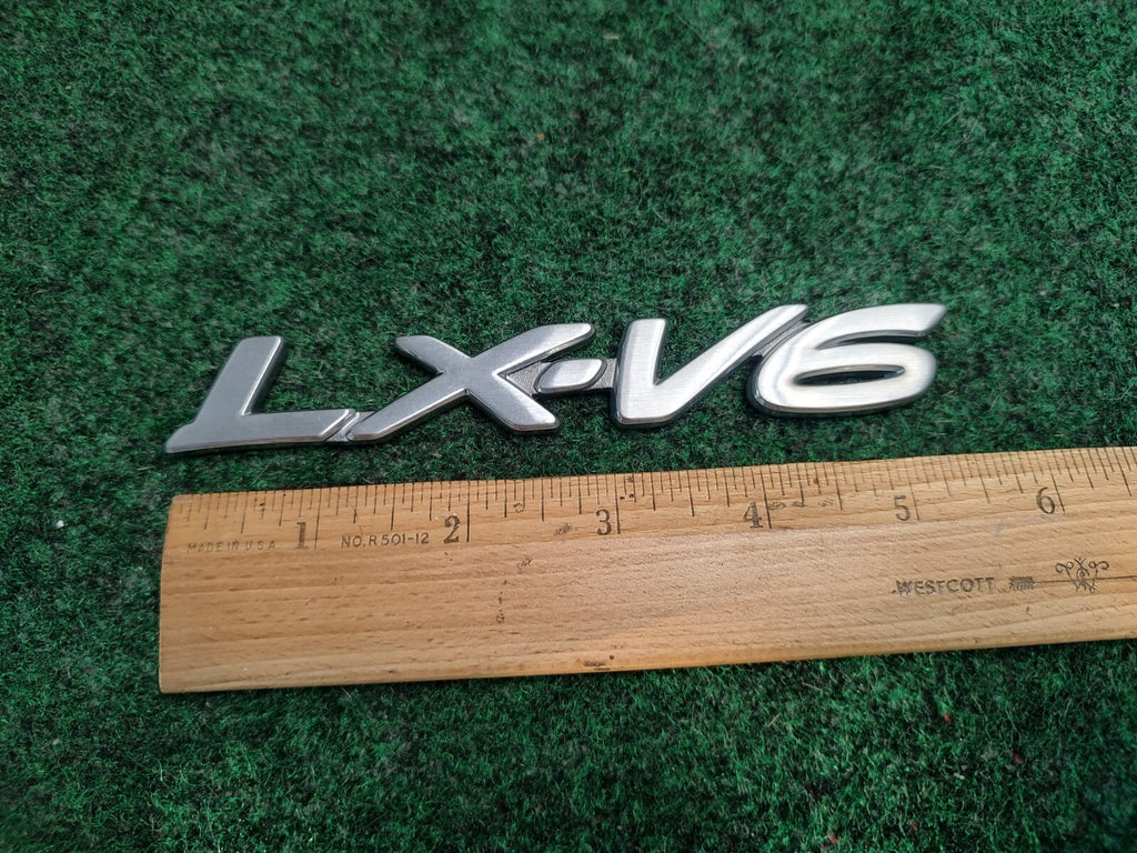 Mazda OEM 2001-2006 Tribute LX-V6 Lx V Rear Emblem Badge Logo Nameplate Name 3S8