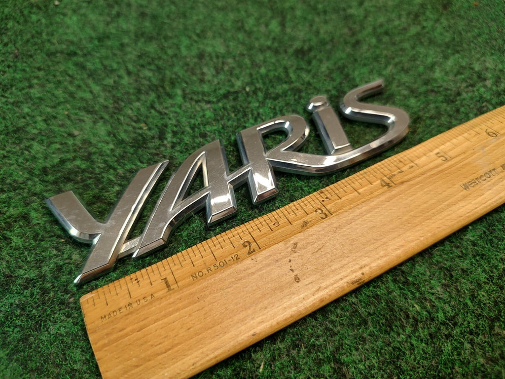 2006-2011 TOYOTA YARIS REAR EMBLEM LOGO BADGE SYMBOL CHROME LETTERS OEM 2S7