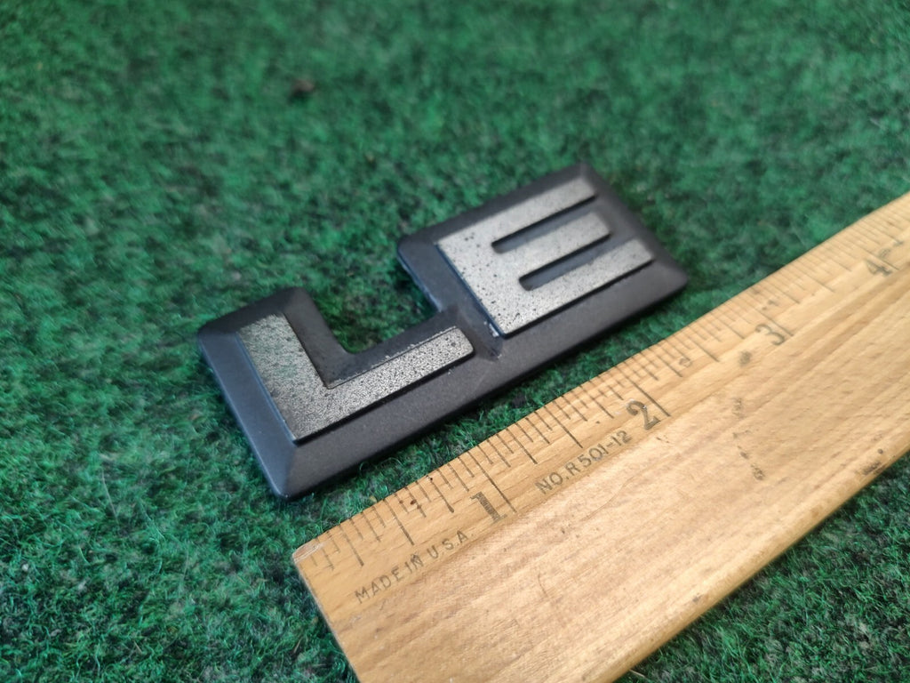 1987-1996 Dodge Dakota LE Cab Corner Emblem Name Plate Badge  55026887 3S9