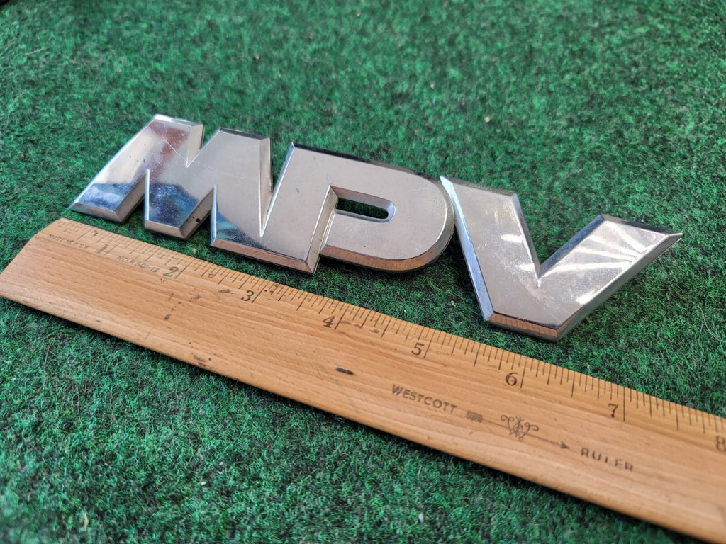2000-2006 Mazda 'MPV' Rear Trunk Liftgate Chrome Emblem OEM LC63-51-720 1M4