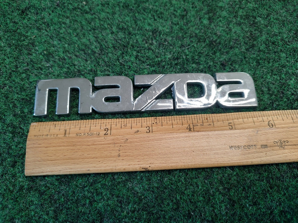 2000-2002 MAZDA 626 TRUNK LID EMBLEM Name Plate Nameplate GG2A-51711 2S8