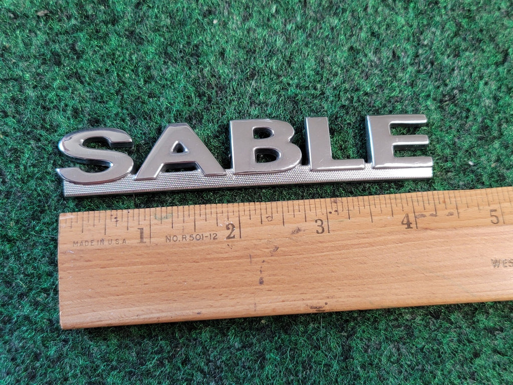 00 01 02 03 MERCURY SABLE REAR GATE LID EMBLEM BADGE SYMBOL LOGO OEM 4S8