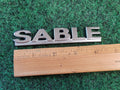 00 01 02 03 MERCURY SABLE REAR GATE LID EMBLEM BADGE SYMBOL LOGO OEM 4S8
