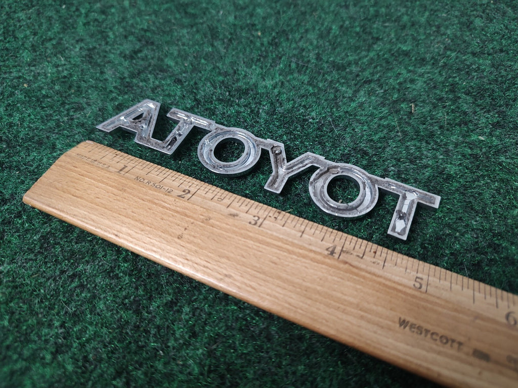 Toyota OEM Chrome Plastic 5" Rear Trunk Emblem Badge Logo Nameplate Name 1M4