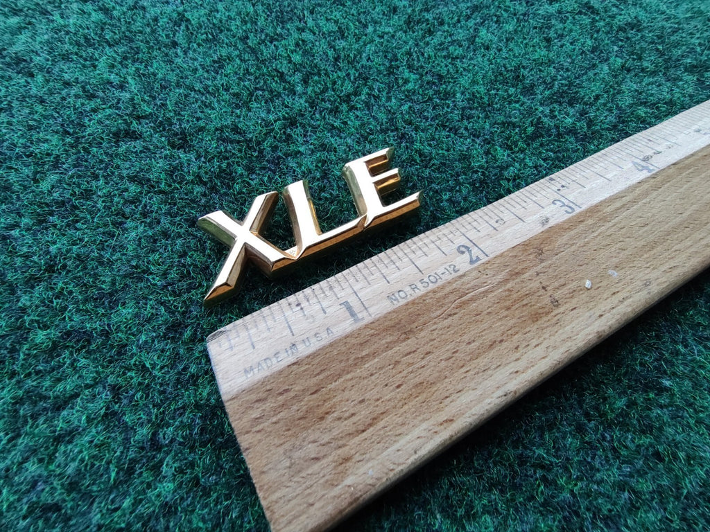 TOYOTA CAMRY XLE REAR GOLD EMBLEM LOGO BADGE SYMBOL NAME PLATE OEM  5S4