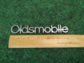 Oldsmobile Cutlass Supreme NOS GM Rear Nameplate Emblem Chrome 16502255 4S7
