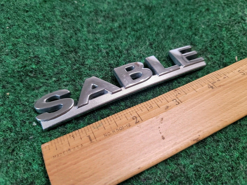 00 01 02 03 MERCURY SABLE REAR GATE LID EMBLEM BADGE SYMBOL LOGO OEM 2M4