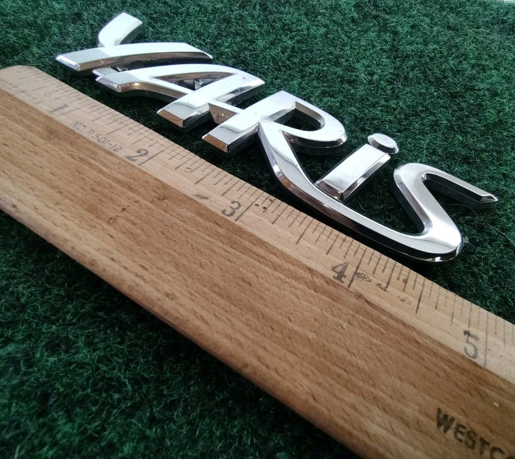2006-2011 TOYOTA YARIS REAR EMBLEM LOGO BADGE SYMBOL CHROME LETTERS OEM 5S5