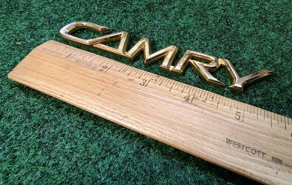 TOYOTA CAMRY REAR GATE LID GOLD EMBLEM LOGO BADGE SYMBOL OEM 9L3