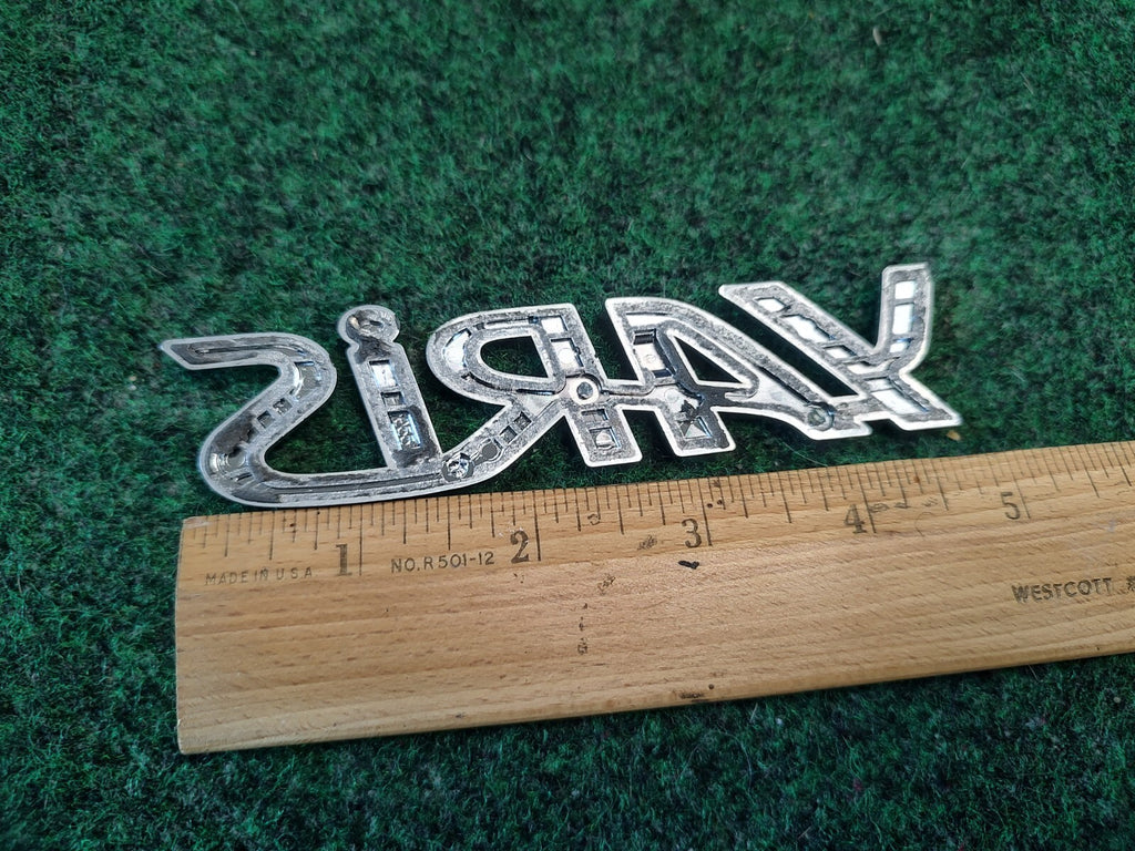 2006-2011 TOYOTA YARIS REAR EMBLEM LOGO BADGE SYMBOL CHROME LETTERS OEM 3S7