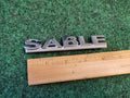 00 01 02 03 MERCURY SABLE REAR GATE LID EMBLEM BADGE SYMBOL LOGO OEM 1M6