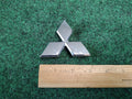 2002-2005 Mitsubishi Eclipse Rear Trunk Emblem Logo Nameplate MR971390 OEM 1S4