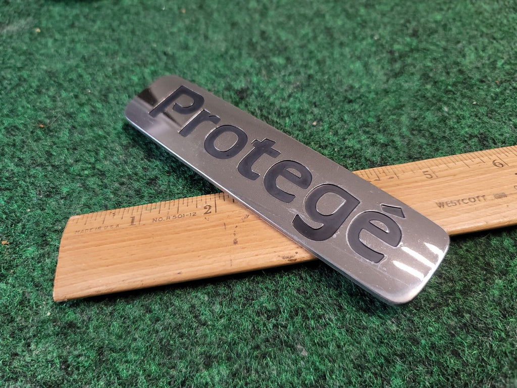 1999-2001 Mazda Protege Emblem Rear Lid Trunk Badge Logo Symbol Chrome OEM 2M4