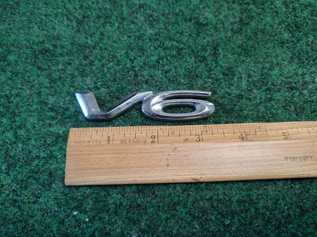 Geuine Toyota Solara rear V6 Emblem 1999-2003 75444-06050 3S8