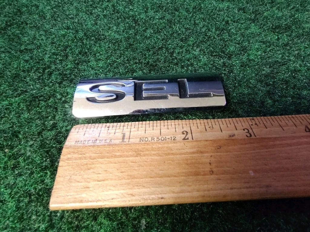 08 09 10 11 FORD FOCUS SEL REAR TRUNK LID EMBLEM LOGO BADGE SYMBOL USED OEM 5S7