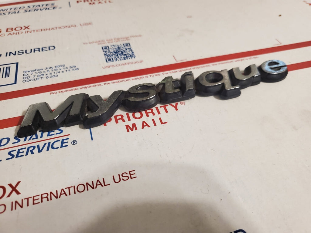 95 96 97 98 99 00 MERCURY MYSTIQUE REAR EMBLEM LOGO BADGE SIGN SYMBOL OEM 4L9