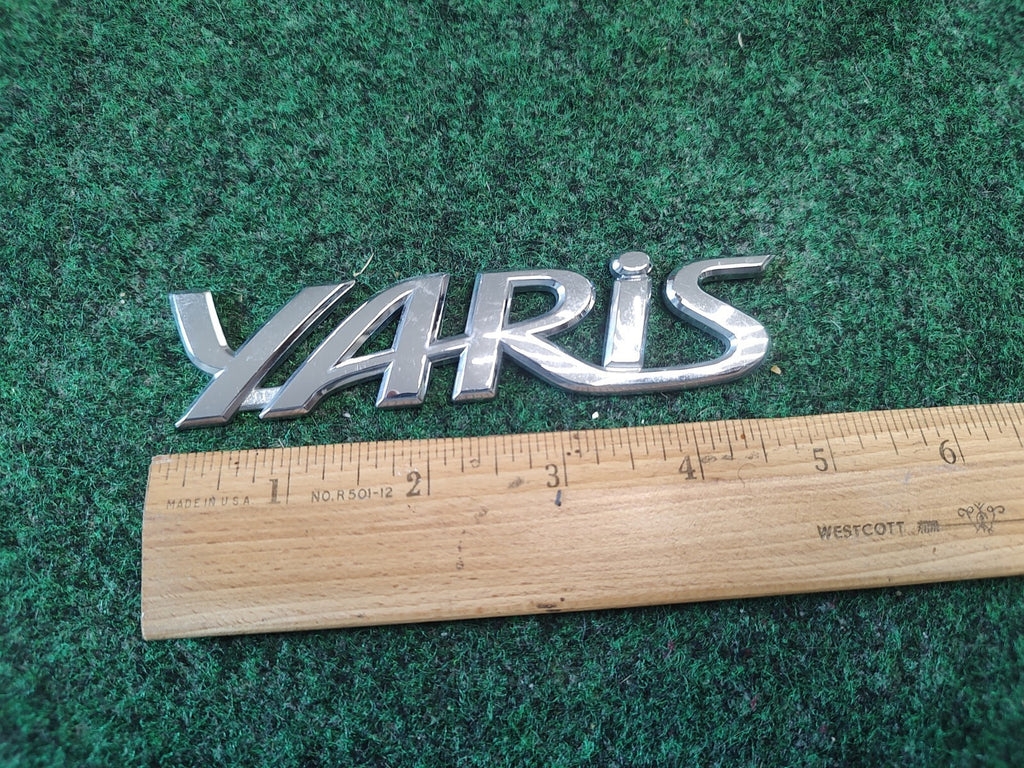 2006-2011 TOYOTA YARIS REAR EMBLEM LOGO BADGE SYMBOL CHROME LETTERS OEM 3S7