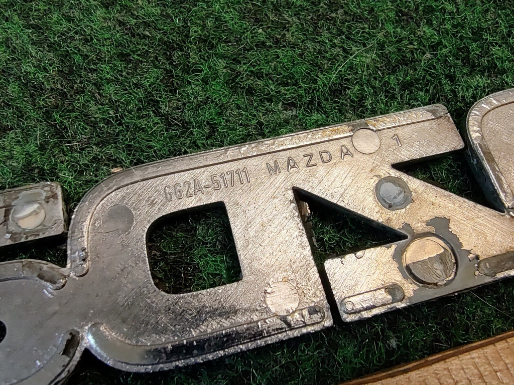 2000-2002 MAZDA 626 TRUNK LID EMBLEM Name Plate Nameplate GG2A-51711 2S8