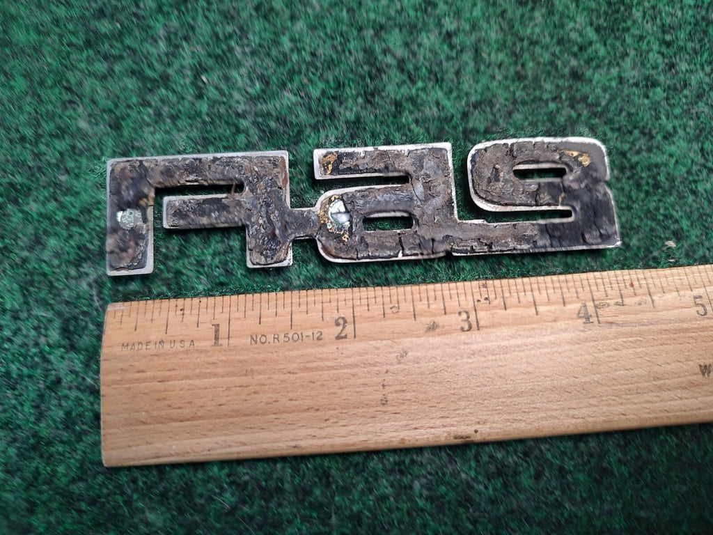 1984-1989 CHEVY CELEBRITY 2.5 FI REAR SIDE EMBLEM BADGE SYMBOL LOGO OEM 4S9