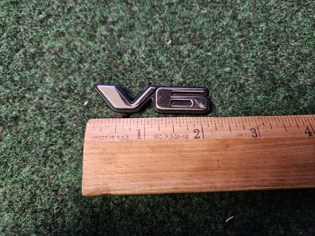 Pontiac OEM V6 Chrome Black Plastic Emblem Badge Logo Nameplate Name Plate 5L9