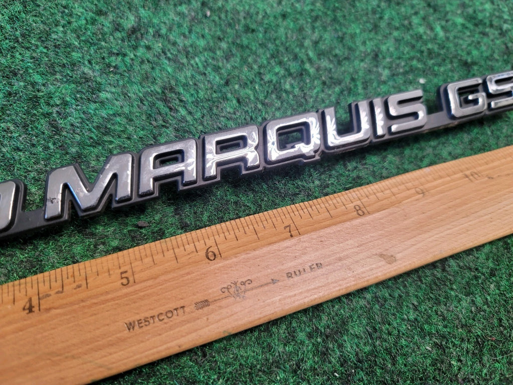98 99 00 01 02 MERCURY GRAND MARQUIS GS REAR EMBLEM BADGE SYMBOL OEM 1M6