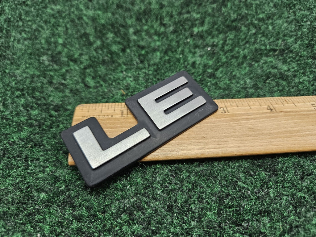 1987-1996 Dodge Dakota LE Cab Corner Emblem Name Plate Badge  55026887 GL2