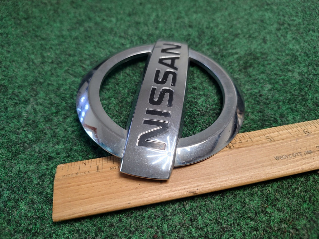 2004-2015 Armada NISSAN Logo Liftgate Emblem Chrome Finish 93491-7S000 OEM 1S9