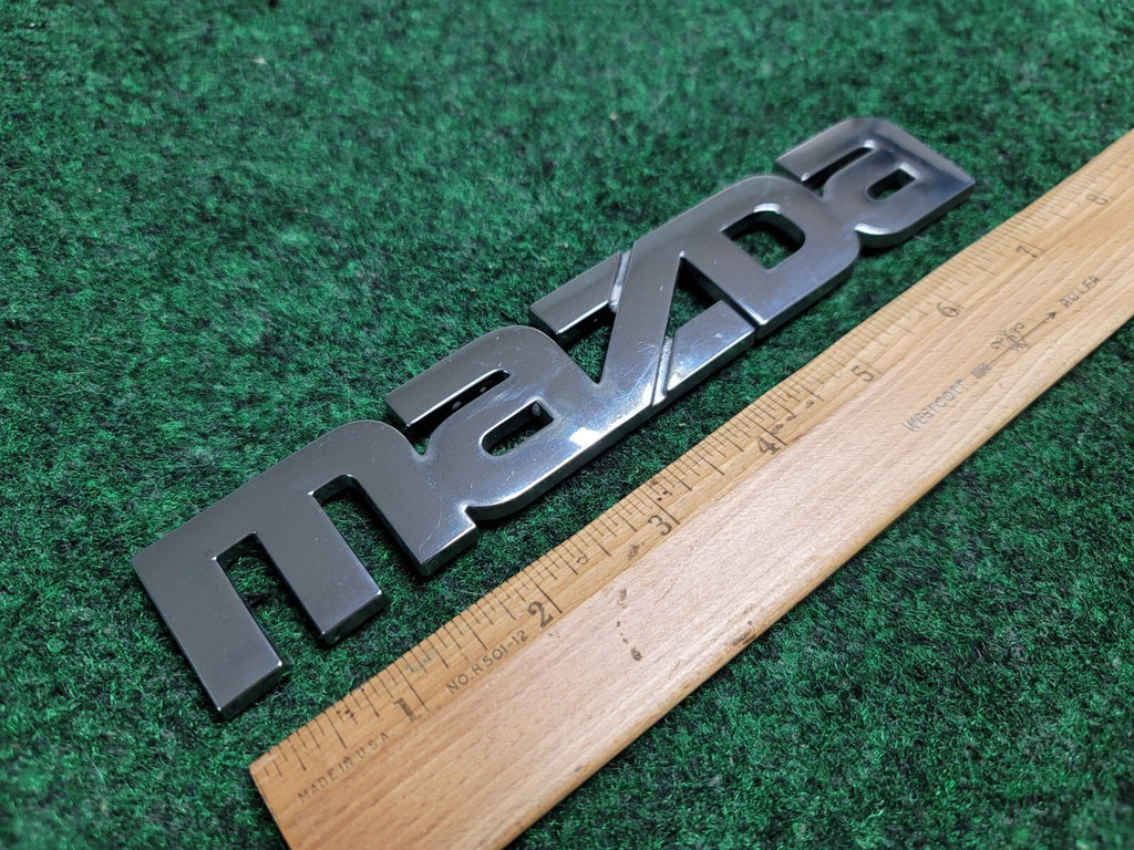 2000-2006 Mazda MPV Rear Emblem Name Plate LC62-51710 2M5
