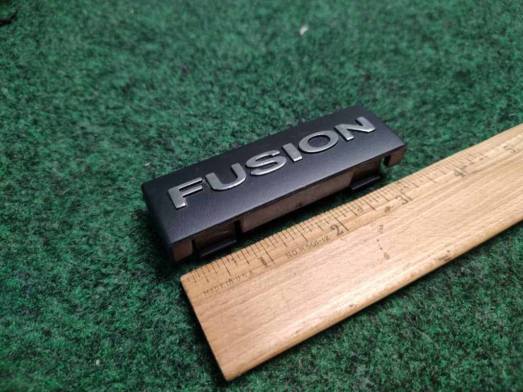 2006-2009 FORD FUSION DASH EMBLEM LOGO BADGE SYMBOL USED OEM 2S9