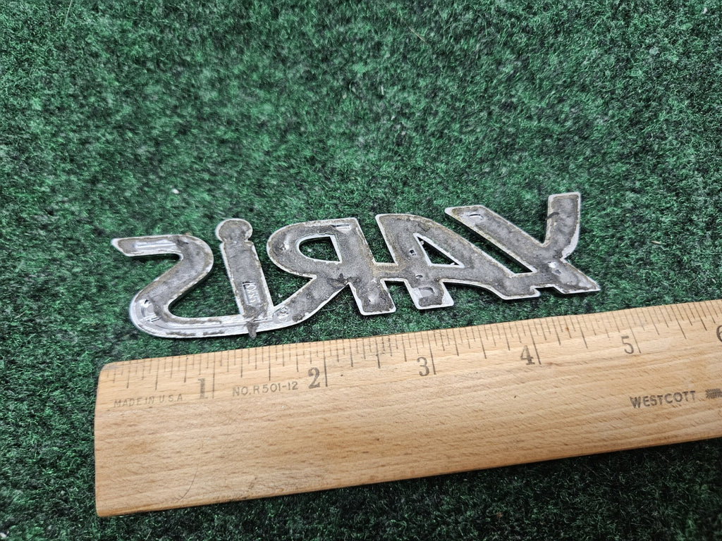2006-2011 TOYOTA YARIS REAR EMBLEM LOGO BADGE SYMBOL CHROME LETTERS OEM GL1