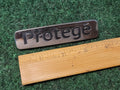 Mazda OEM 2001 2002 2003 Protege Sedan Rear Emblem Badge Logo Name 51 720 1M1