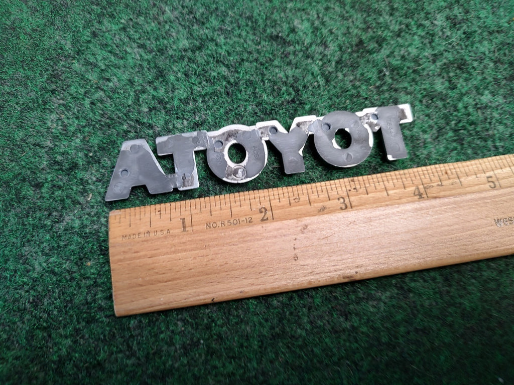 TOYOTA 04-08 Solara 09-11 Matrix Rear Trunk Lid Hatch Emblem OEM 75447-AA040 4S4