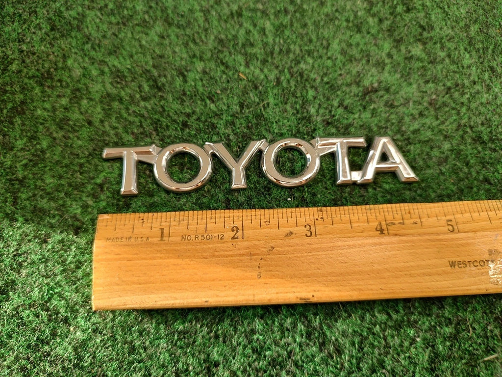 Toyota OEM Chrome Plastic Emblem Badge Logo Nameplate Name Plate Insignia 1S1