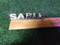 00 01 02 03 MERCURY SABLE REAR GATE LID EMBLEM BADGE SYMBOL LOGO OEM 2M4