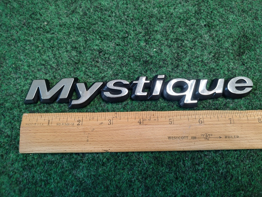 95 96 97 98 99 00 MERCURY MYSTIQUE REAR EMBLEM LOGO BADGE SIGN SYMBOL OEM 2S8