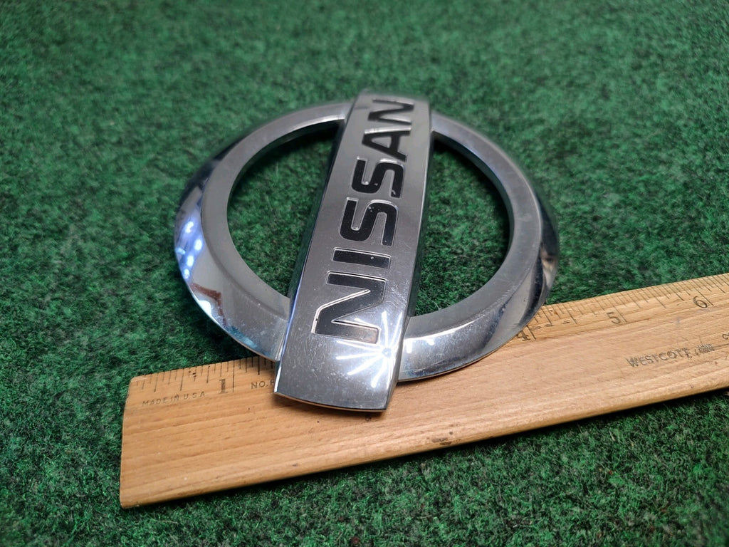 2004-2015 Armada NISSAN Logo Liftgate Emblem Chrome Finish 93491-7S000 OEM 1S9