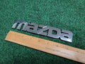 2000-2006 Mazda MPV Rear Emblem Name Plate LC62-51710 2M5