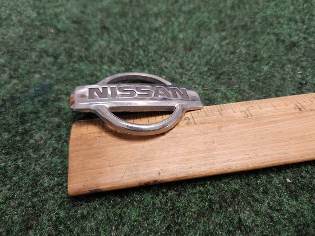 1988-02 Nissan Pathfinder Rear "Nissan" Emblem Badge Name Plate 90891-2W100 6M7