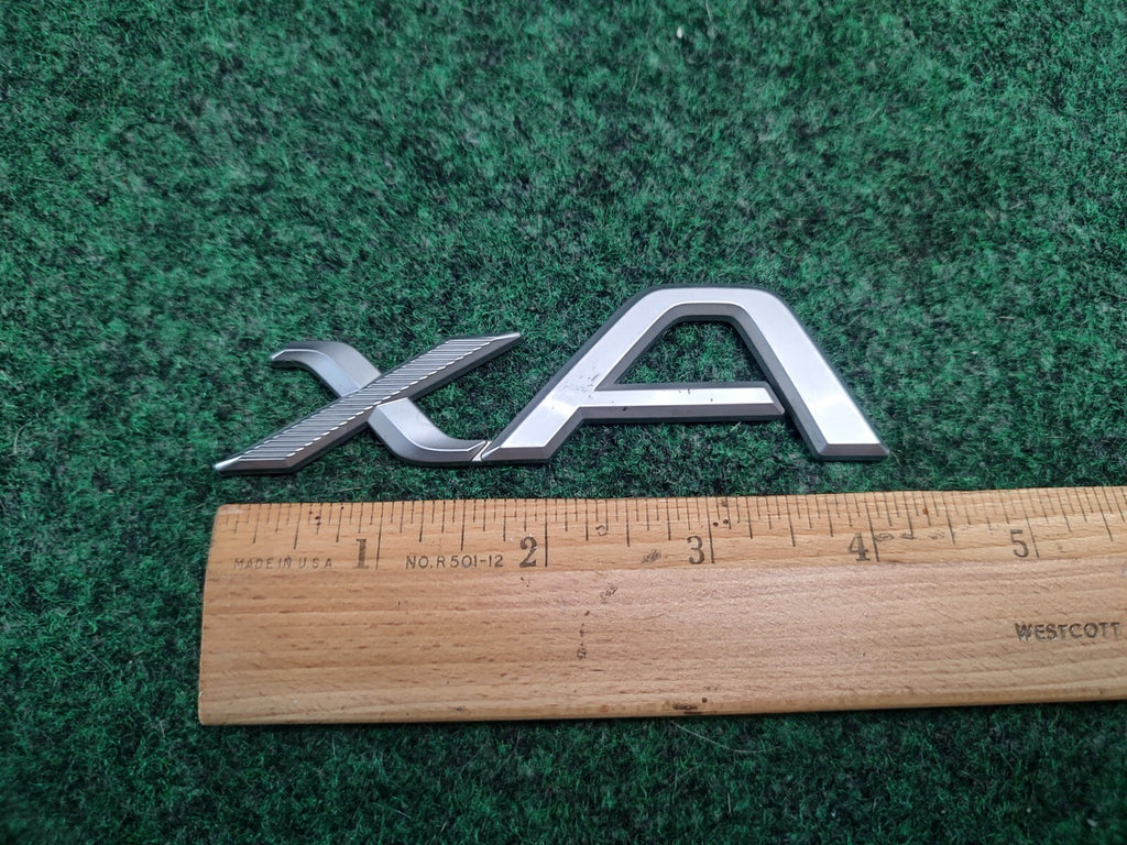2004-2006 Scion xA Emblem Logo Badge Symbol Rear Tailgate Trunk Silver Gray 3S7