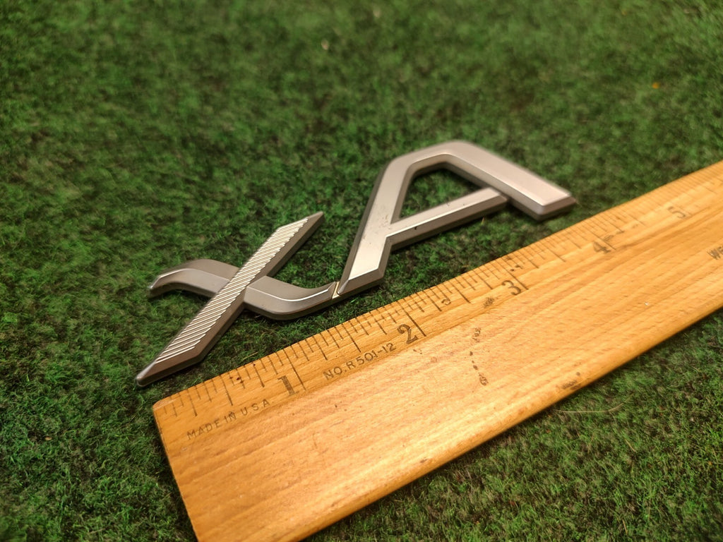 2004-2006 Scion xA Emblem Logo Badge Symbol Rear Tailgate Trunk Silver Gray 3S7