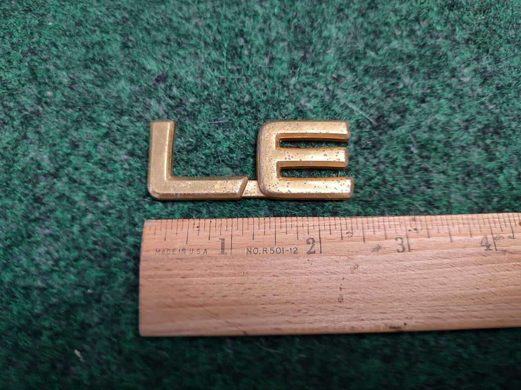 Toyota OEM LE Chrome Emblem Badge Logo Nameplate Name Plate Gold 4S4