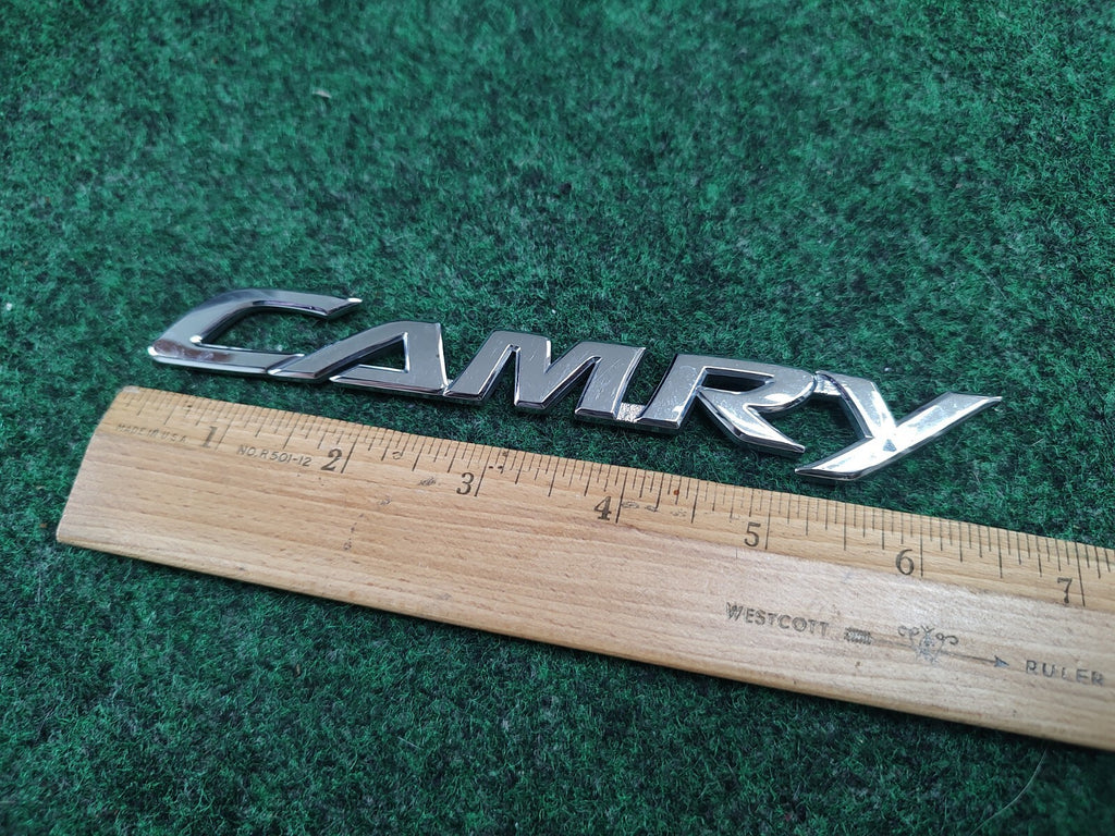 2007-2011 Toyota Camry Rear Door Trunk Nameplate 75442-06050 OEM 8L2
