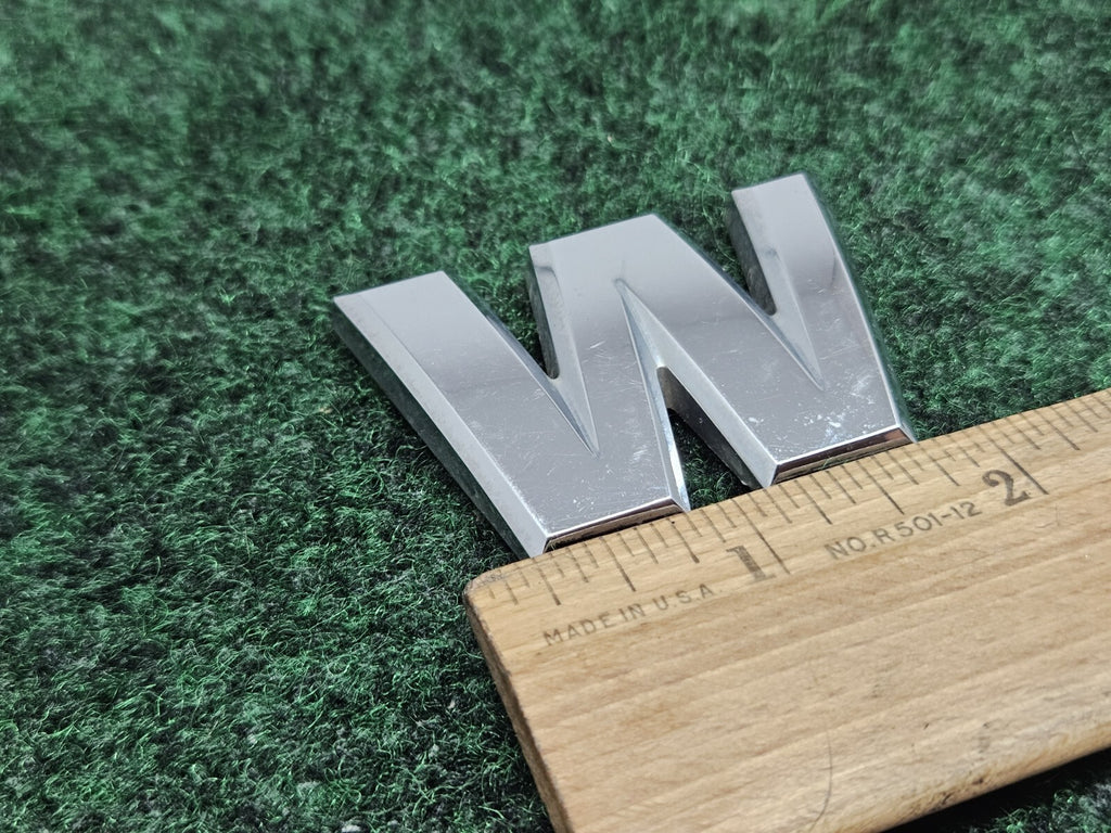 Nissan Armada “W” Emblem Letter Badge Decal Rear Door Hatch OEM 7S9