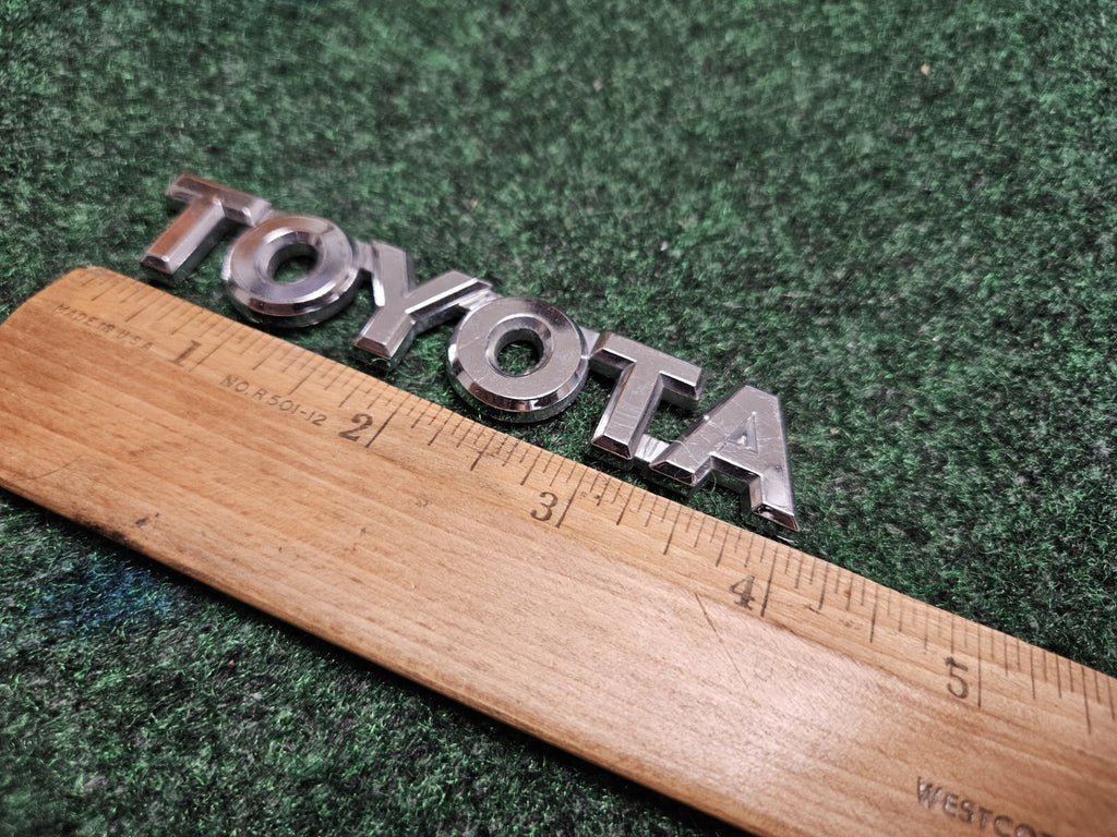 TOYOTA 04-08 Solara 09-11 Matrix Rear Trunk Lid Hatch Emblem OEM 75447-AA040 5M9