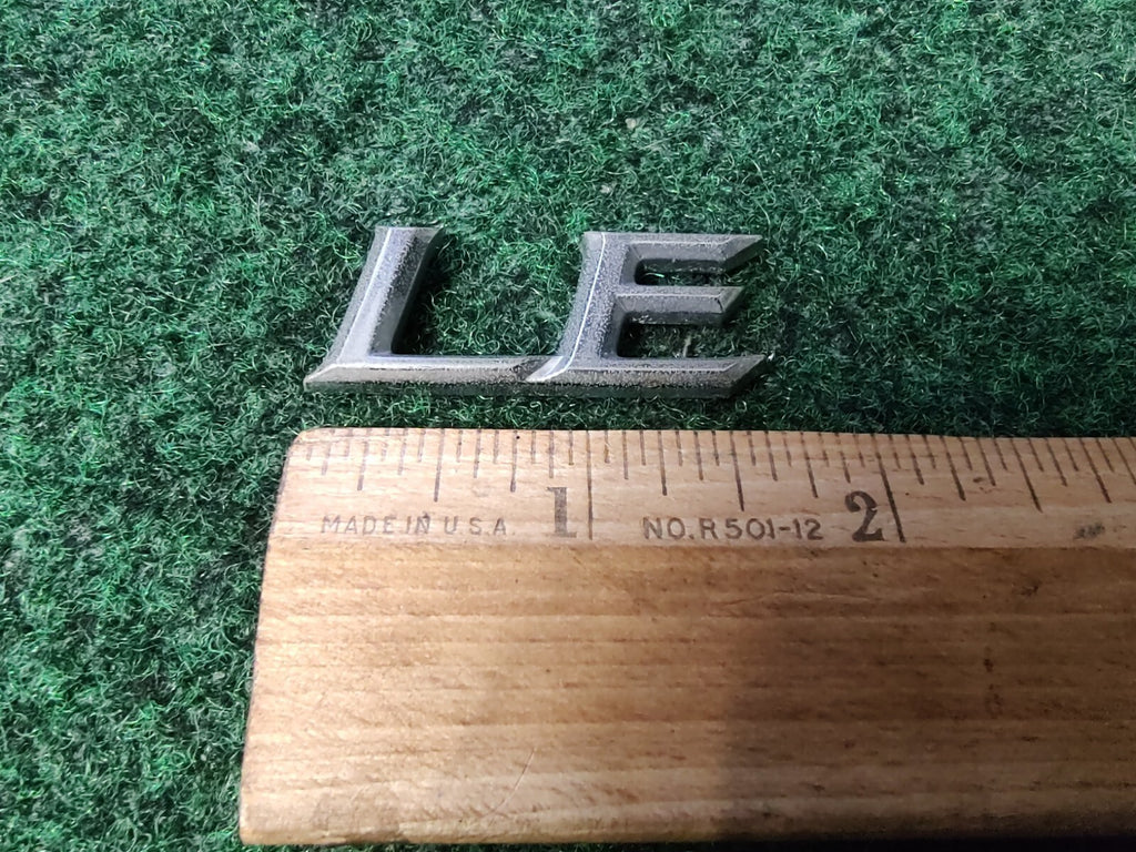 Genuine Toyota Camry "LE" Emblem USED 2002-2006  Rear 75443-AA100 3S6