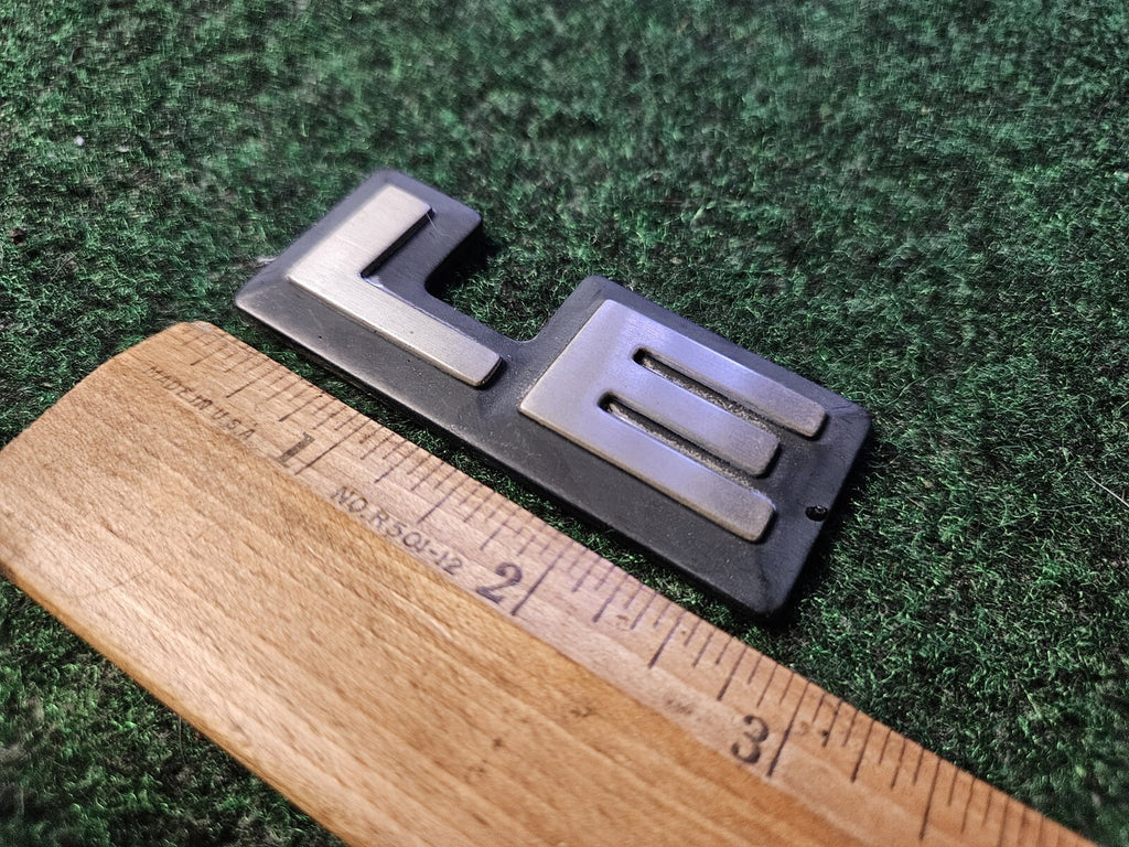 1987-1996 Dodge Dakota LE Cab Corner Emblem Name Plate Badge  55026887 5L9