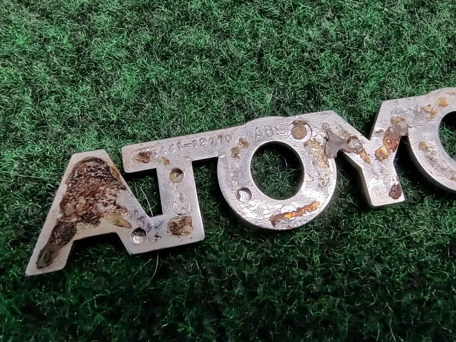 Toyota OEM 1998-2002 Corolla Sedan Rear Trunk Emblem Badge Logo 75441-12770 1S6