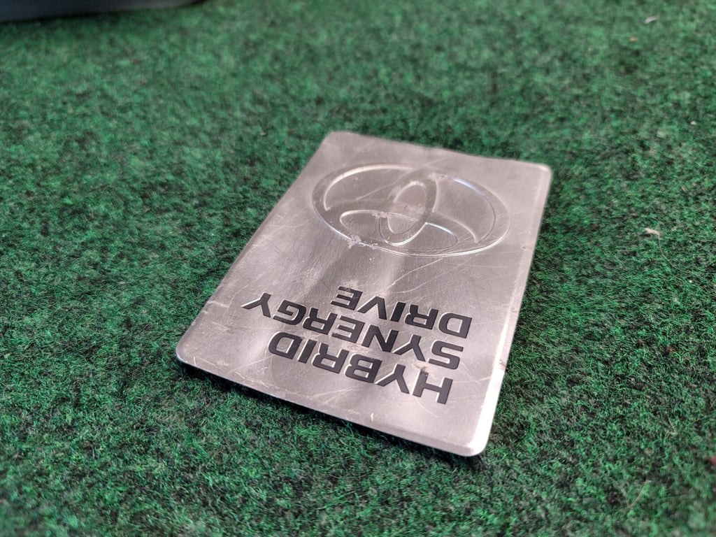 2004-2009 TOYOTA PRIUS HYBRID SYNERGY DRIVE DC CONVERTER EMBLEM BADGE OEM 2M3