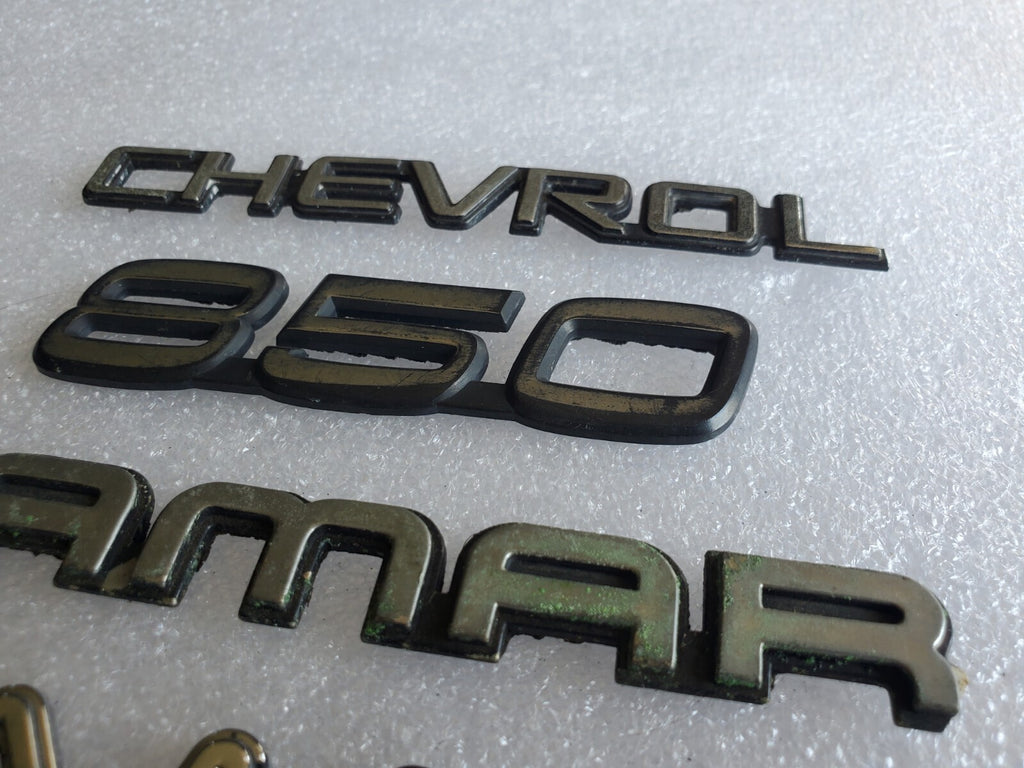 Misc Lot Of Emblwms Vintage Letters Logo OEM Mark VIII VOLVO Regal Camaro VNTG