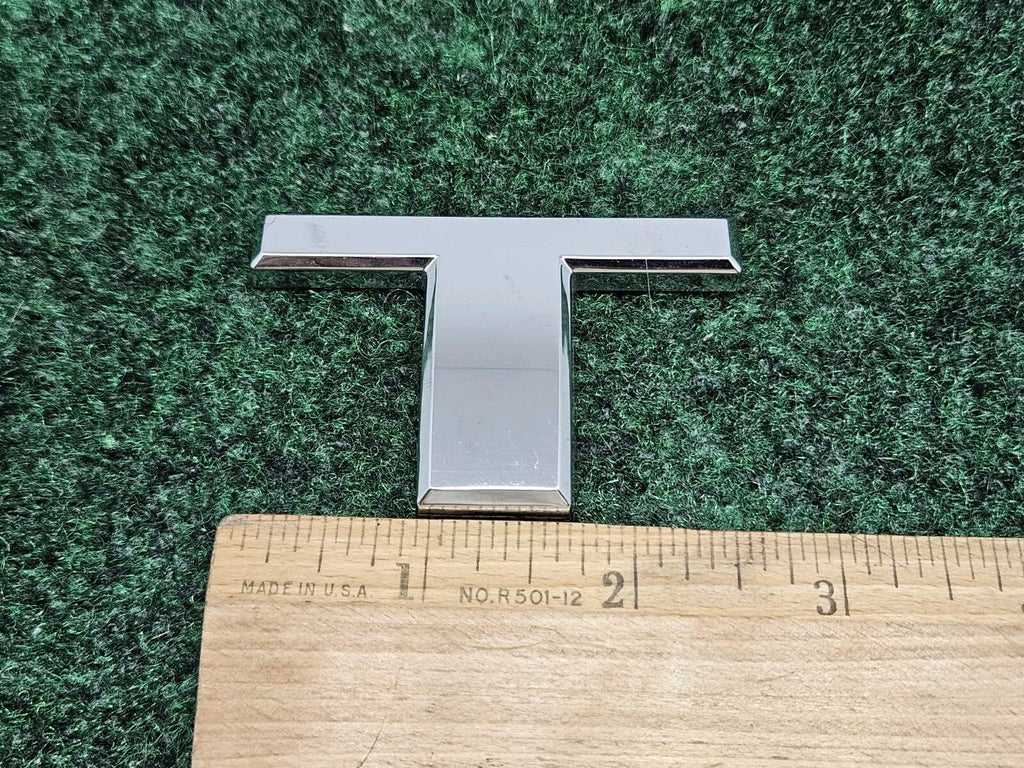 T 2004-2015 Nissan Titan Rear Tailgate Emblem Badge Letter "T" OEM 7S8